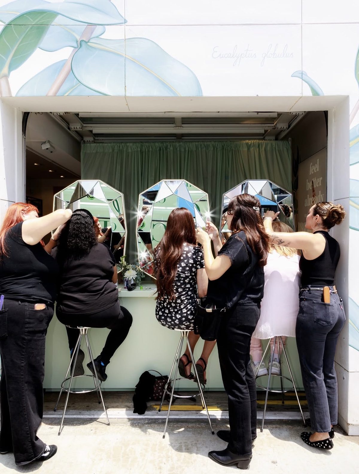 Hair stylists from One Light Promotions styling guests at the Garnier x Cherlato activation